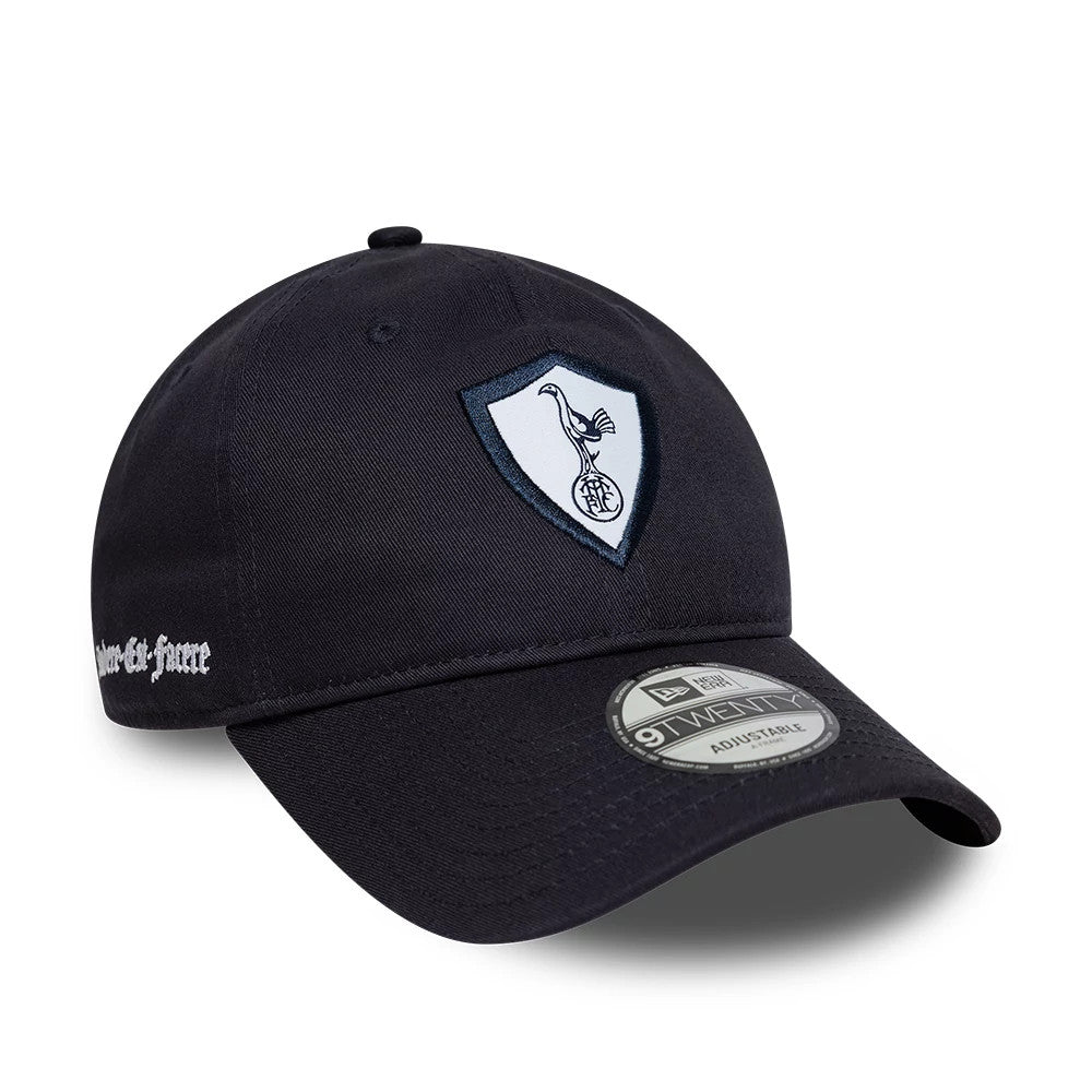 Tottenham Hotspur FC 96 Kit Navy New Era 9TWENTY Adjustable Cap, three-quarter view showing the embroidered white and blue club crest on the front panel, a dark curved visor with a 9TWENTY size sticker, and script text on the left side.
