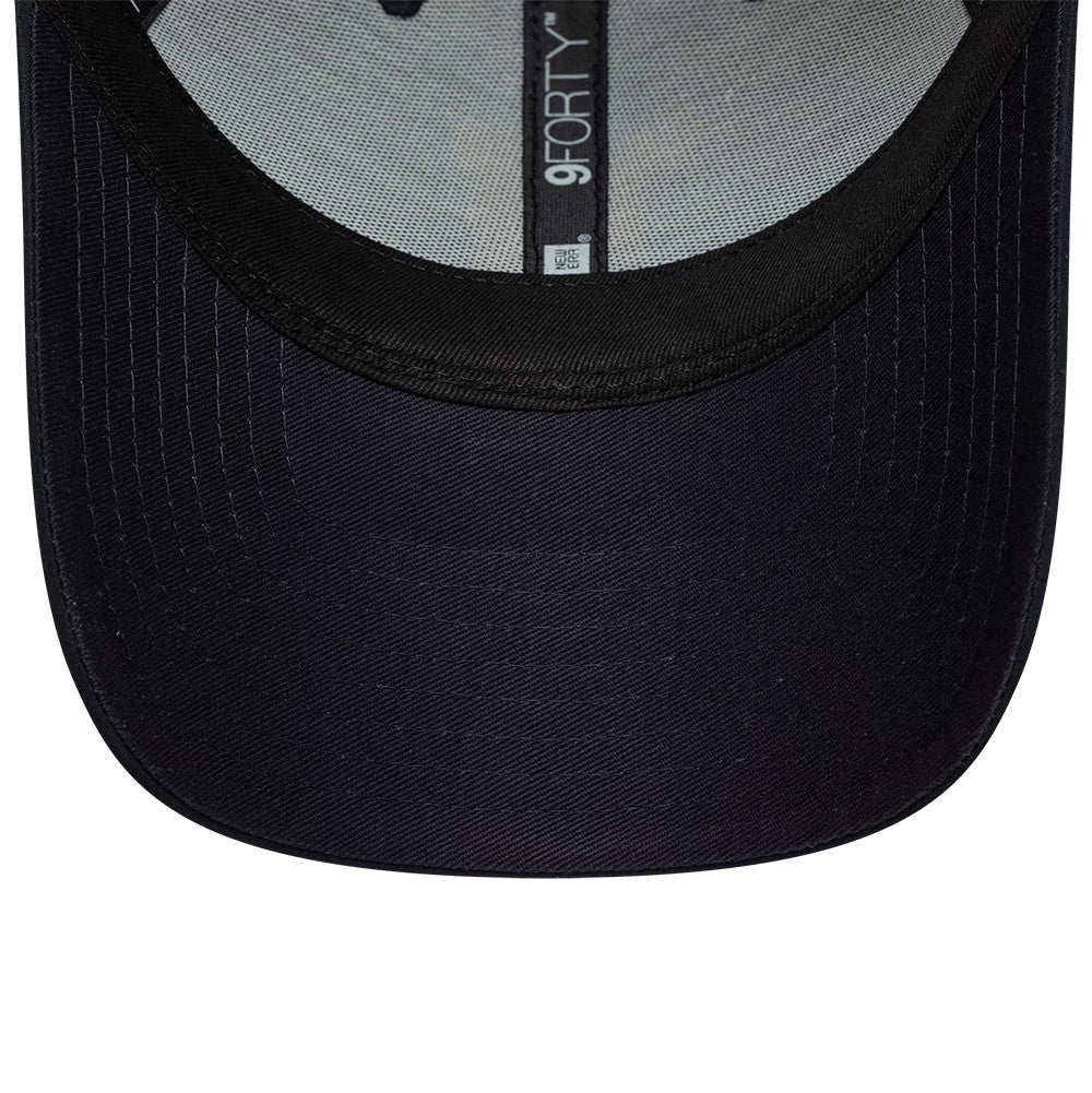 Manchester United FC Gold Navy New Era 9FORTY Adjustable Cap, inside view showing grey branded taping along the centre, a black sweatband lining the edge, and a detailed look at the navy undervisor contrasting with the black visor.