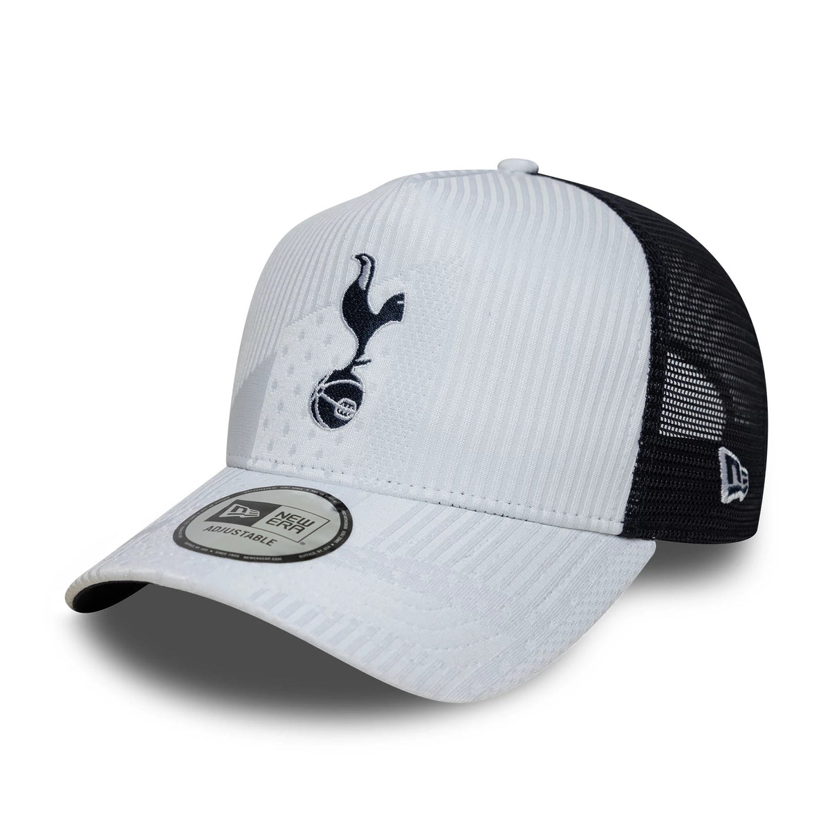 Tottenham Hotspur FC Pattern Knit White New Era 9FORTY E-Frame Trucker Adjustable Cap, three-quarter view showing an embroidered black Tottenham Hotspur crest on the white front panel, black mesh rear panels.