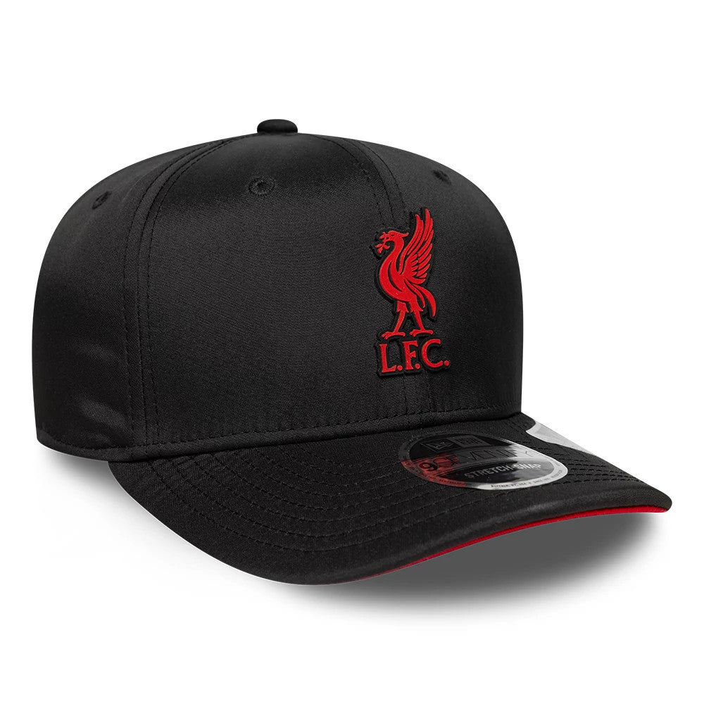 Liverpool FC Gradient Black New Era 9SEVENTY Stretch Snap Adjustable Cap, front view showing a red raised embroidered Liverbird logo with LFC lettering on the front panel, curved black visor with a 9SEVENTY size sticker and red underside.