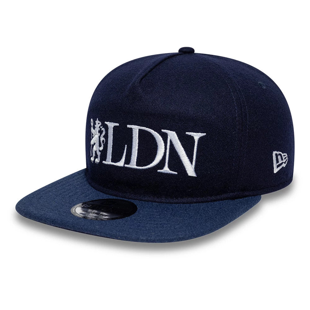 Chelsea FC London Wool Navy New Era 19TWENTY Adjustable Cap, front view showing the white embroidered LDN text with a lion logo on the front panel, a navy flat visor with a 19TWENTY size sticker, and the New Era flag logo on the left side.