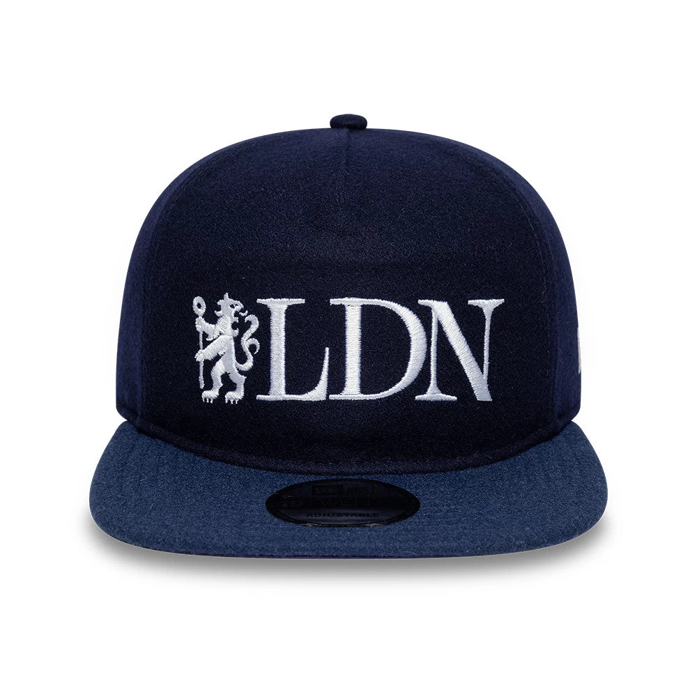 Chelsea FC London Wool Navy New Era 19TWENTY Adjustable Cap, front view showing white LDN embroidery with a lion logo on the structured navy crown, complemented by a flat navy visor and a black size sticker on the top.