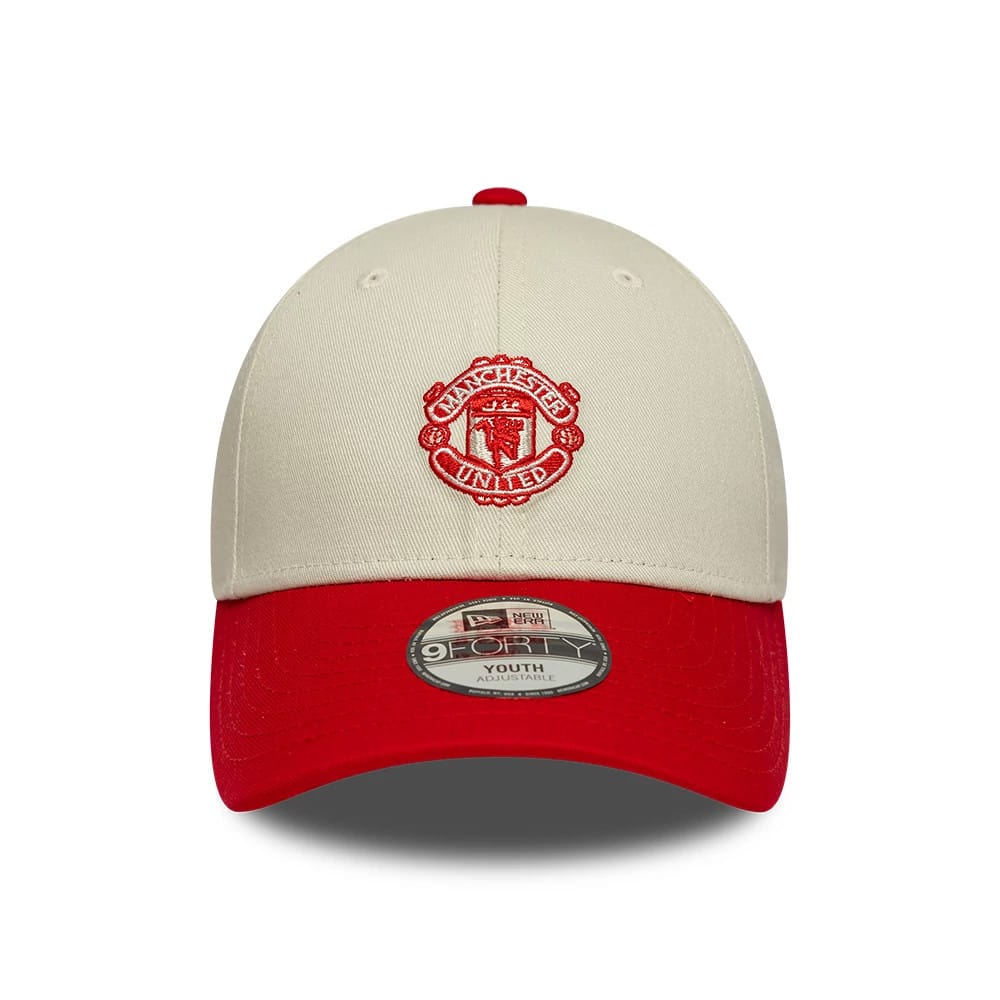 Pictured is this Youth Manchester United FC Contrast 9FORTY cap in cream. 2