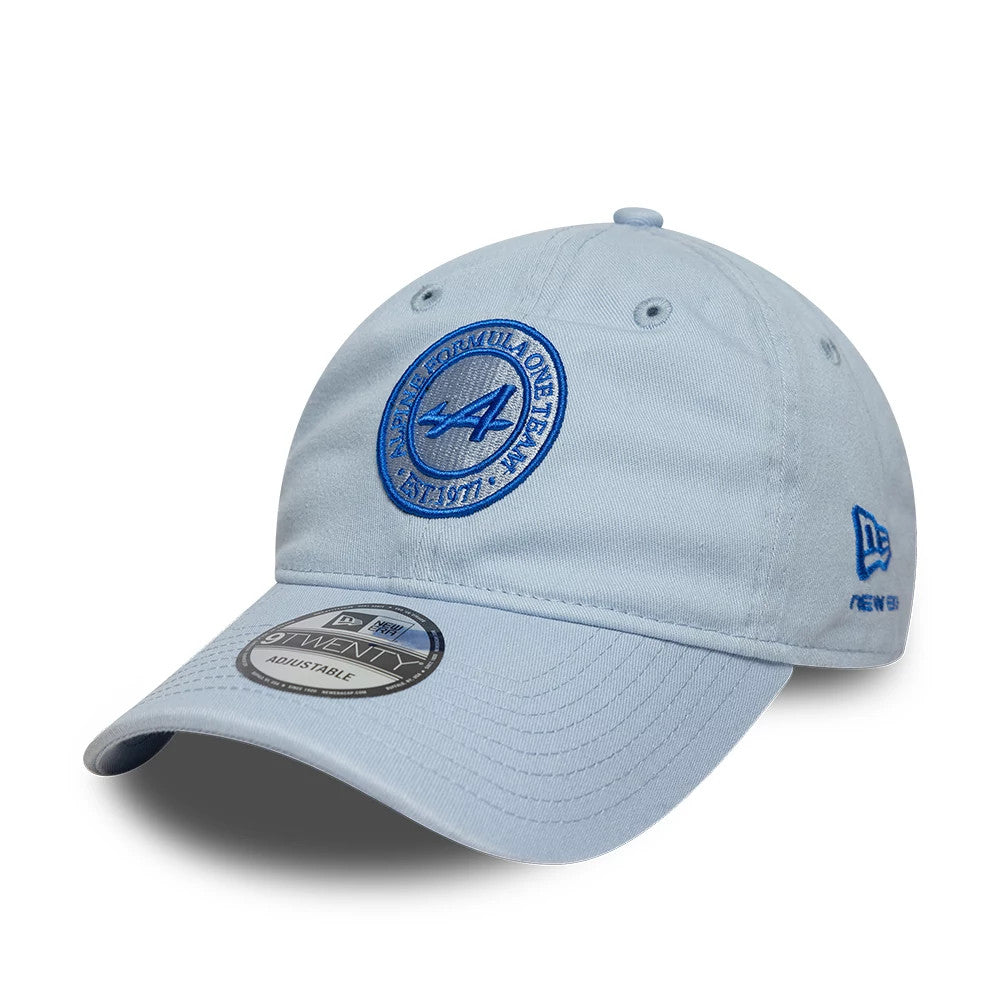 Alpine Racing Heritage Logo Blue New Era 9TWENTY Adjustable Cap, front view showing the blue embroidered Alpine logo on the light blue front panel, a curved visor with a 9TWENTY size sticker, and the New Era flag logo on the left side.