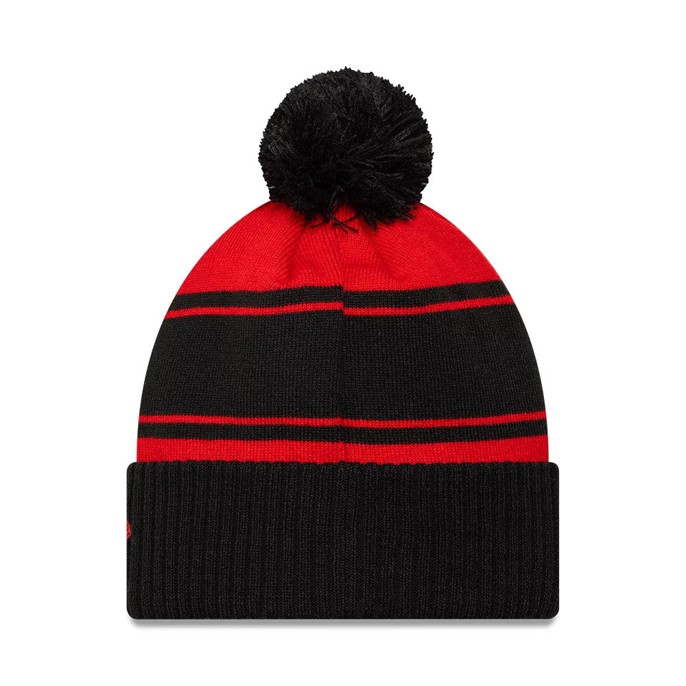 New Era Rugby Club Toulon Black Cuff Knit Beanie Hat, front view showing a red and black striped pattern with a large black pom-pom on top and a thick black ribbed cuff at the base.