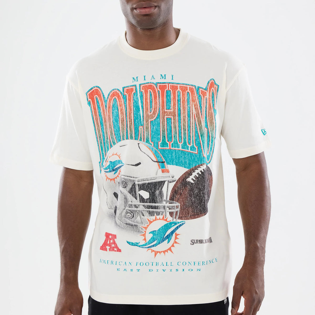 New Era Miami Dolphins NFL Sport Classic Cream T-Shirt, front view showing Dolphins lettering across the chest in blue and orange, a graphic of a football helmet and ball, and the New Era logo embroidered on the left sleeve.
