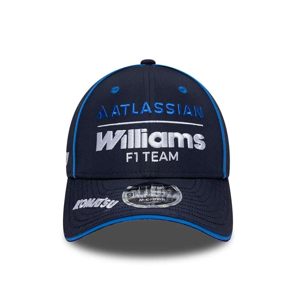 Williams Team Navy New Era 9FORTY M-Crown Adjustable Cap, front view showing a white Williams F1 Team logo with blue Atlassian text on the curved visor, a 9FORTY size sticker, and blue embroidered top button and eyelets.