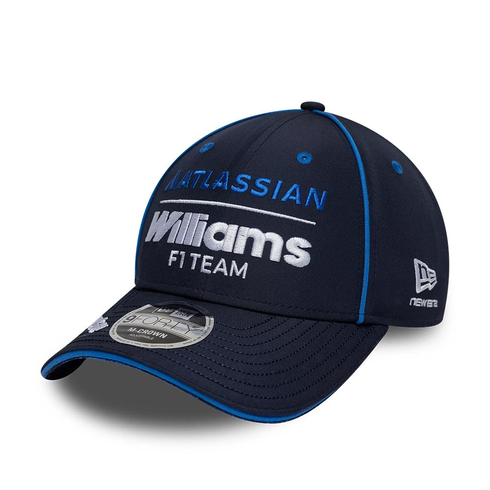 Williams Team Navy New Era 9FORTY M-Crown Adjustable Cap, front view showing white and blue embroidered Atlassian and Williams F1 Team lettering on the navy curved visor, 9FORTY size sticker and the New Era flag logo on the left side.