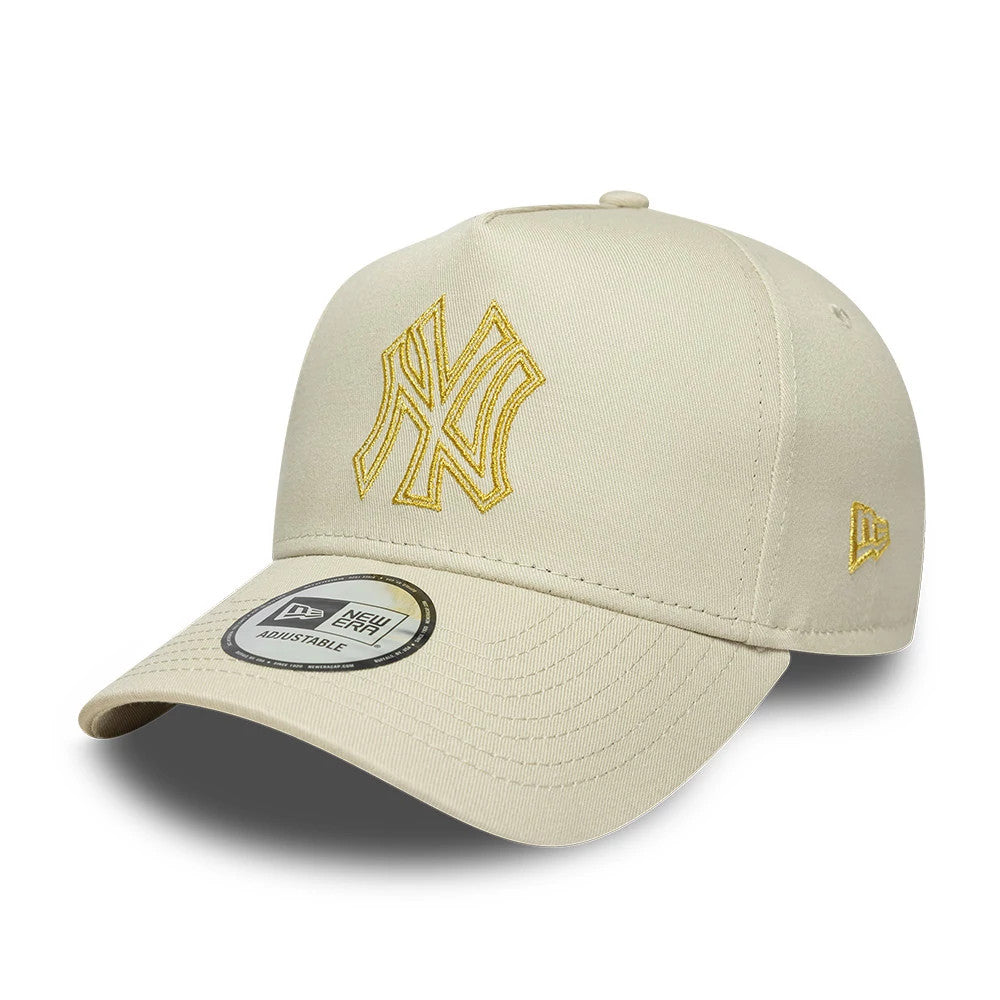 New York Yankees MLB Metallic Outline Cream New Era 9FORTY A-Frame Adjustable Cap, three-quarter view showing the gold embroidered NY logo on the front panel, a curved cream visor with an adjustable sticker.