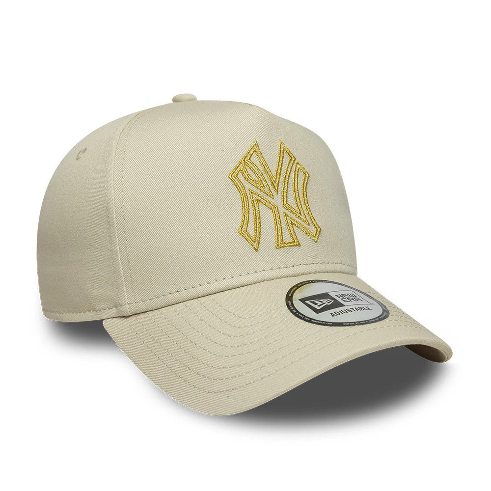 New York Yankees MLB Metallic Outline Cream New Era 9FORTY A-Frame Adjustable Cap, front view showing a gold embroidered NY logo on the structured cream crown, with a curved visor and 9FORTY size sticker centrally placed.