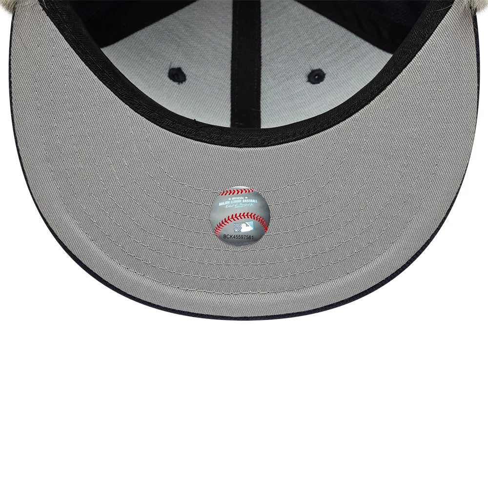 New York Yankees MLB Cotton Canvas Navy New Era 59FIFTY Fitted Cap, inside view showing the grey undervisor with a round MLB logo sticker in the centre, black panel taping and a contrasting grey sweatband.