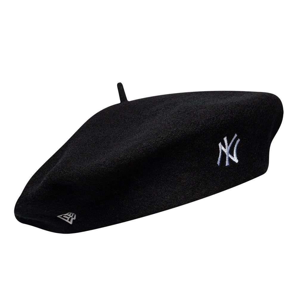 New Era New York Yankees MLB Wool Script Black Beret, three-quarter view showing the white embroidered NY logo on the side, with a black wool finish and a small New Era flag logo in white on the front edge.