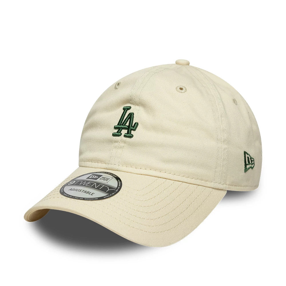 LA Dodgers MLB Mini Logo Cream New Era 9TWENTY Adjustable Cap, front view showing a green LA logo embroidered on the cream front panel, with a curved visor featuring a 9TWENTY size sticker and the New Era flag logo on the left side.