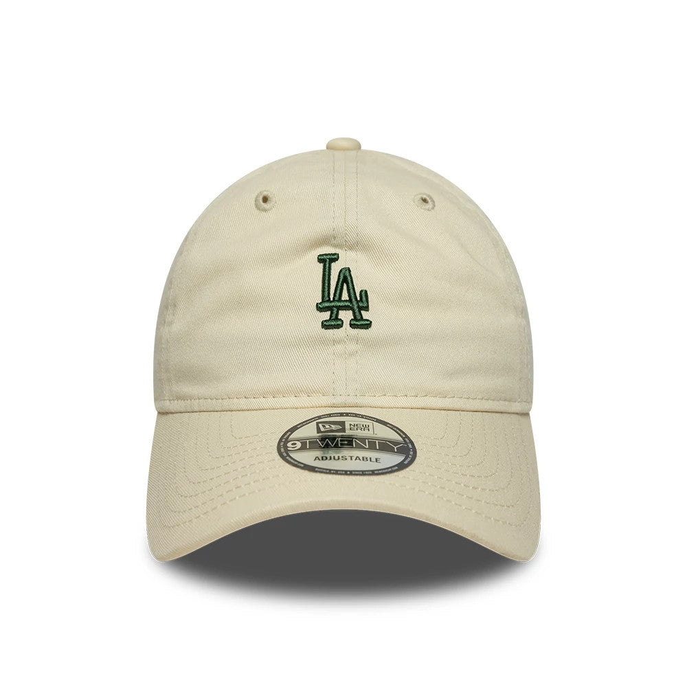 LA Dodgers MLB Mini Logo Cream New Era 9TWENTY Adjustable Cap, front view showing the dark green embroidered LA logo on the unstructured cream crown, with a curved visor and a 9TWENTY size sticker placed centrally on the visor.