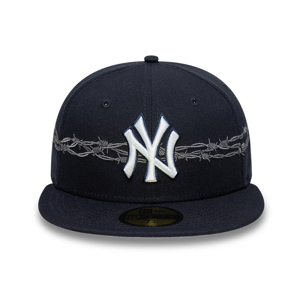 New York Yankees MLB Icon Navy New Era 59FIFTY Fitted Cap, front view showing the white and navy raised embroidered Yankees logo on the front panel, with barbed wire graphics encircling the crown above the navy flat visor.