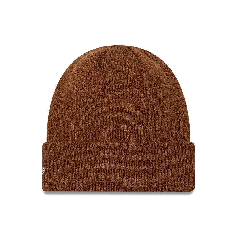 New Era New York Yankees MLB League Essential Brown Cuff Knit Beanie Hat, front view showing a brown knit texture with a fold-over cuff, featuring the embroidered New York Yankees logo in white on the side of the cuff.