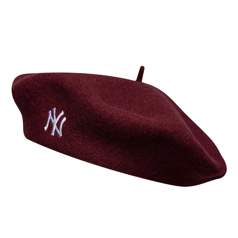 New Era New York Yankees MLB Wool Script Dark Red Beret, side view showing the white NY logo embroidered on the front, with a soft wool texture and a small stem on top, creating a classic and appearance.