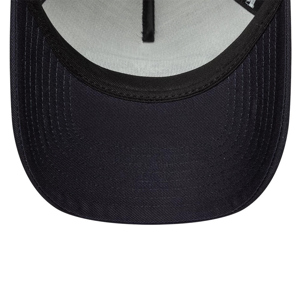 New Era Oval Patch Black 9FORTY A-Frame Trucker Adjustable Cap, inside view showing a grey undervisor, detailed white stitching along the black curved visor, and the interior black seam taping running along the structured front panels.