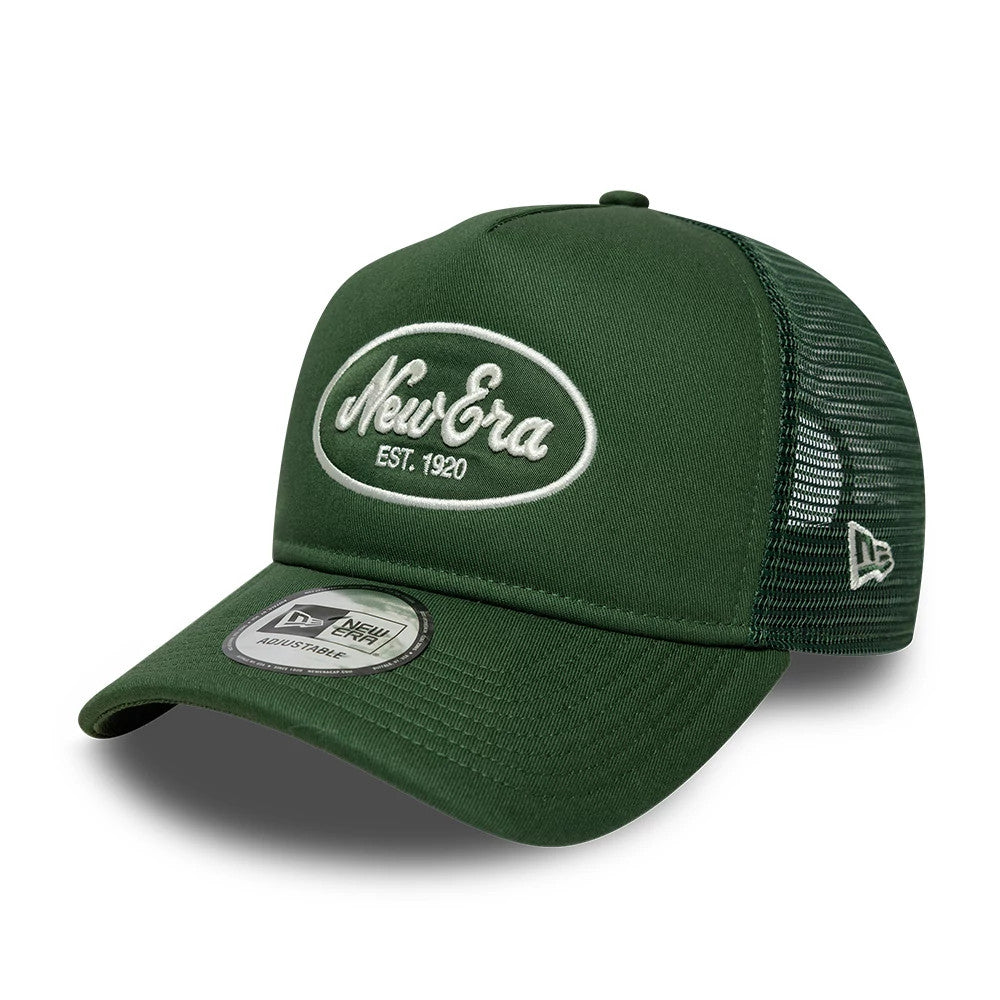 New Era Oval Patch Dark Green New Era 9FORTY A-Frame Trucker Adjustable Cap, three-quarter view showing white embroidered New Era oval patch logo on the structured dark green front panels, with breathable mesh rear panels.