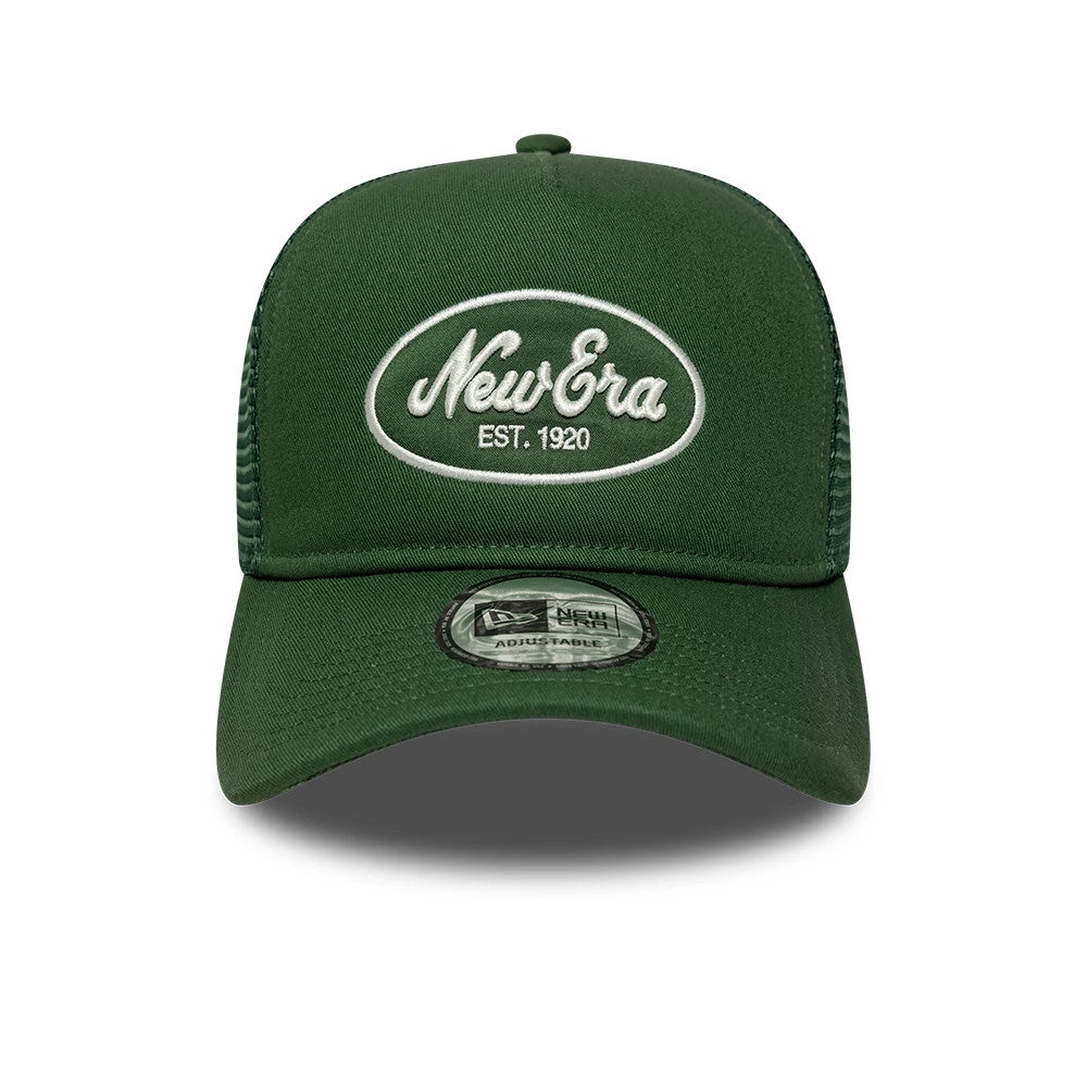 New Era Oval Patch Dark Green 9FORTY A-Frame Trucker Adjustable Cap, front view showing a white embroidered oval New Era logo with EST. 1920 on the front panel, dark green curved visor, and a transparent 9FORTY size sticker on the visor.