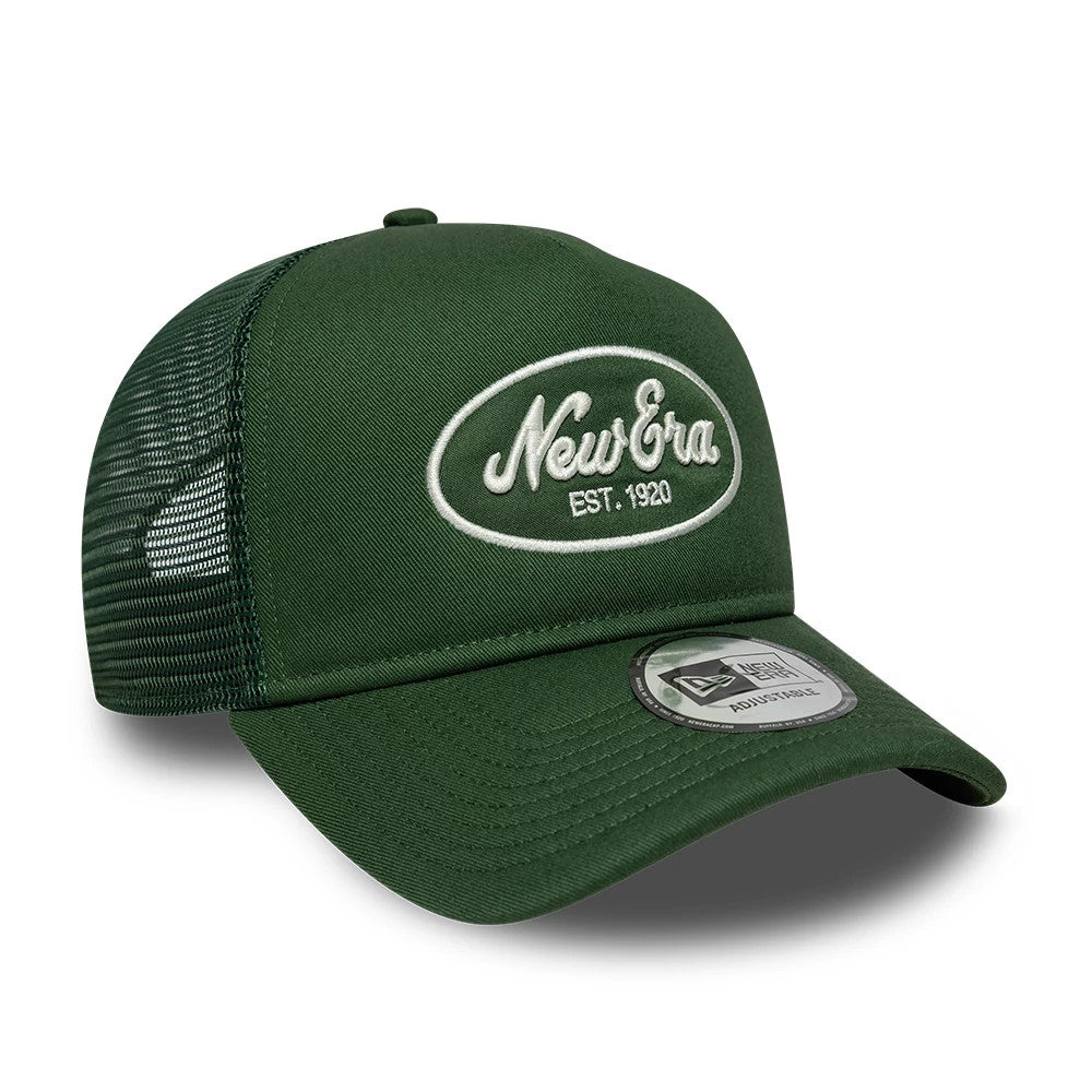 New Era Oval Patch Dark Green 9FORTY A-Frame Trucker Adjustable Cap, three-quarter view showing a white embroidered New Era oval logo on the front panel, a curved dark green visor with a 9FORTY size sticker, and a breathable mesh back.