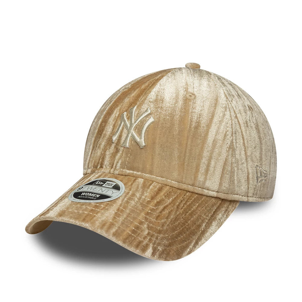 New York Yankees Womens MLB Velour Beige New Era 9TWENTY Adjustable Cap, three-quarter view showing the cream embroidered Yankees logo on the front panel, velour texture throughout, and a 9TWENTY size sticker on the curved visor.