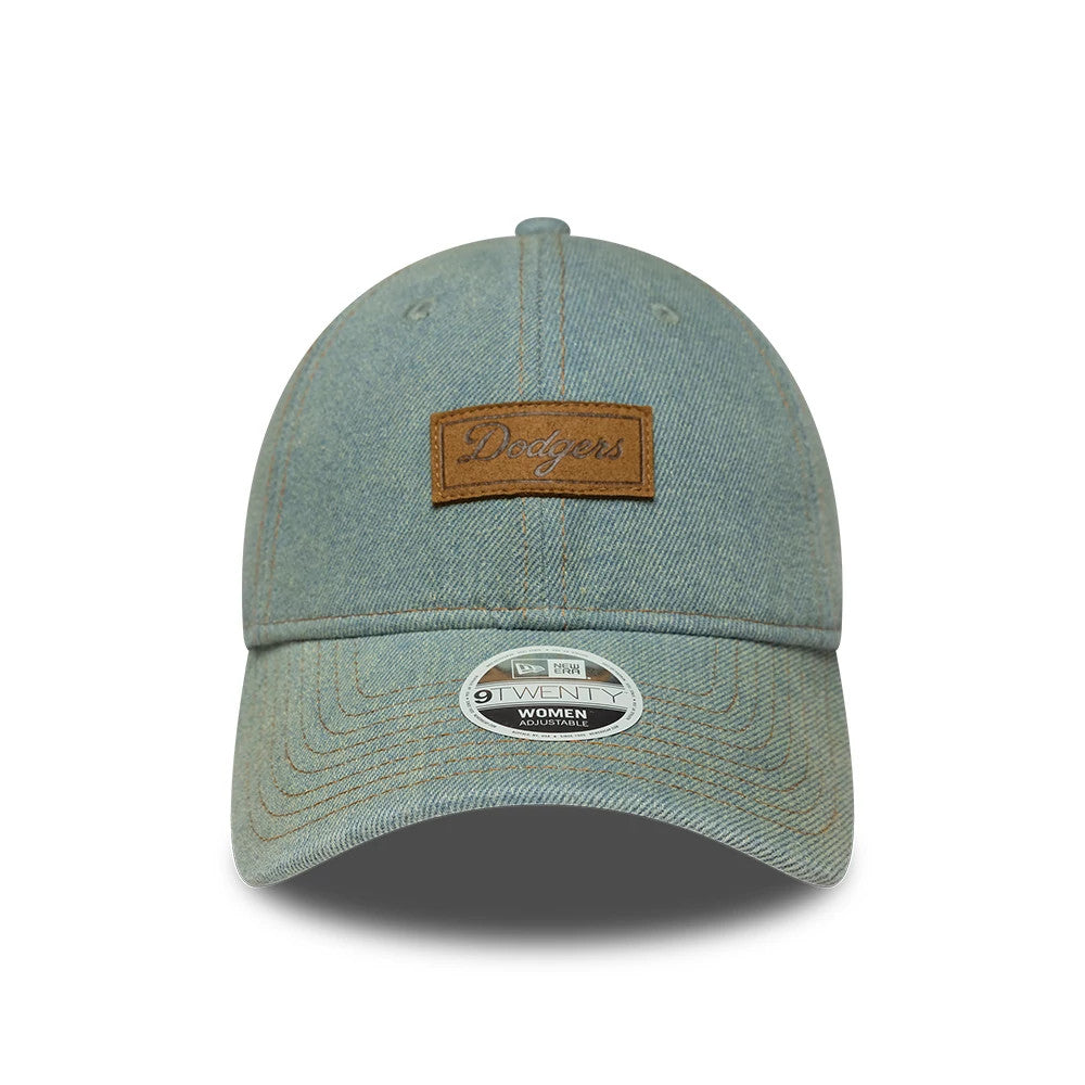 LA Dodgers Womens MLB Denim Pastel Blue New Era 9TWENTY Adjustable Cap, front view showing a brown Dodgers script patch on the front panel above the curved visor, with a 9TWENTY size sticker on the denim fabric.