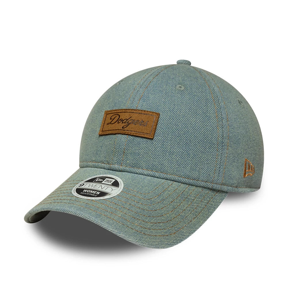 LA Dodgers Womens MLB Denim Pastel Blue New Era 9TWENTY Adjustable Cap, front view showing a brown woven Dodgers logo patch on the front panel, curved denim visor with 9TWENTY size sticker, and embroidered New Era flag in brown on the left side.