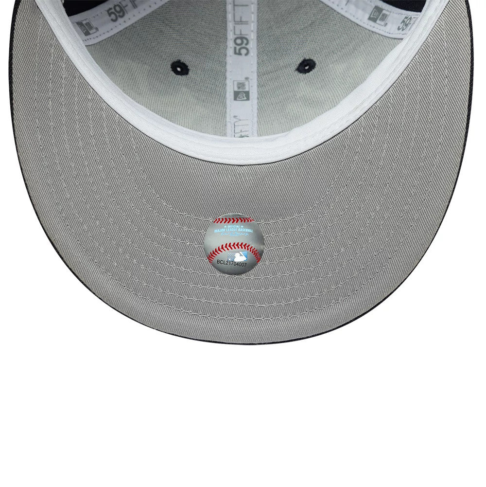 New York Yankees MLB Historic Navy Low Profile New Era 59FIFTY Fitted Cap, inside view showing grey undervisor with a baseball-themed holographic sticker, white taping with 59FIFTY branding, and black eyelets on the structured crown.