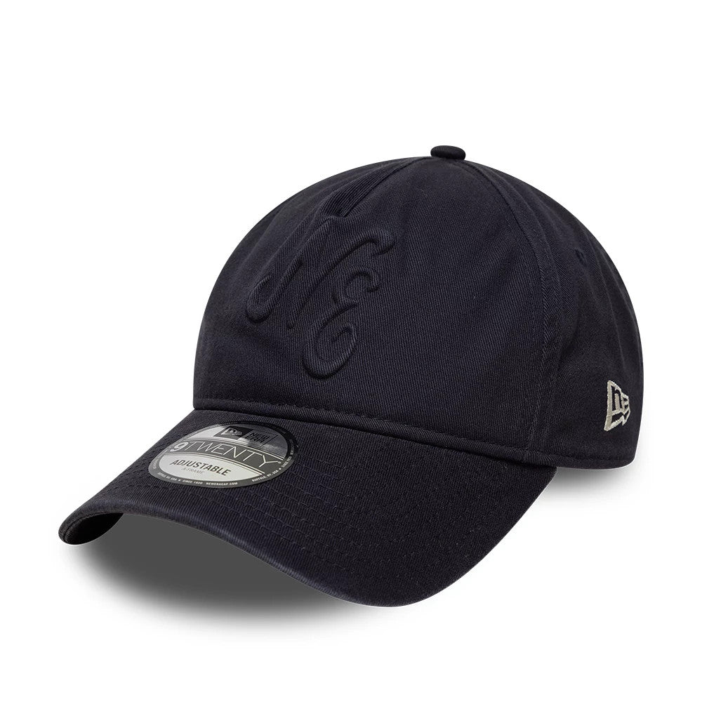 New Era Embossed Navy 9TWENTY A-Frame Adjustable Cap, front view showing a navy embroidered NE logo on the front panels, a curved visor with a 9TWENTY size sticker, and the New Era flag logo in white on the left side.