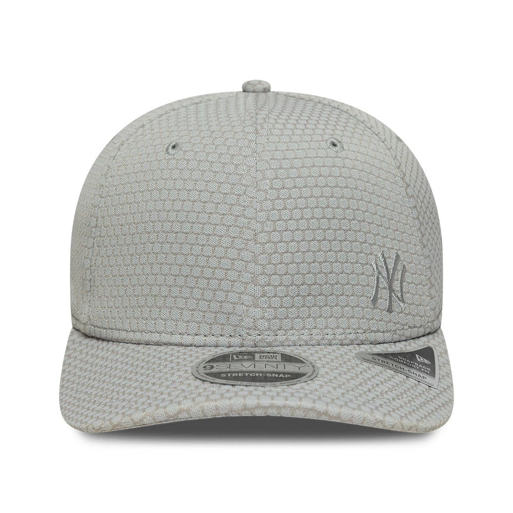 Yankees MLB Flawless Mesh Grey New Era 9SEVENTY Stretch Snap Adjustable Cap, front view showing the grey embroidered NY logo on the front panel, with a distinct textured mesh design and a silver 9SEVENTY size sticker on the curved visor.