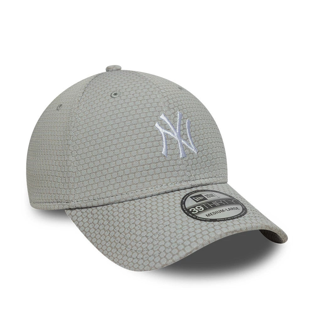 New York Yankees MLB Stretch Mesh Grey New Era 39THIRTY Stretch Fit Cap, three-quarter view showing the white raised embroidery NY logo on the front panel, grey honeycomb mesh texture, and 39THIRTY size sticker on the curved visor.