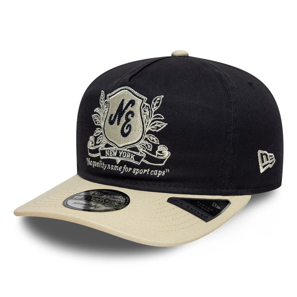 Pictured is this New Era Washed Graphic 19TWENTY cap in navy & cream. 1