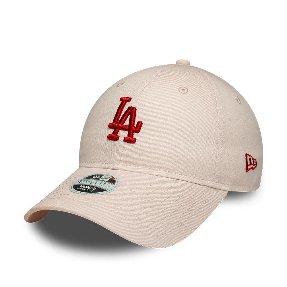 LA Dodgers Womens MLB League Essential Pastel Pink New Era 9TWENTY Adjustable Cap, three-quarter view showing the red embroidered LA logo on the front panel, curved pastel pink visor with a 9TWENTY size sticker, and red New Era flag on the left side.