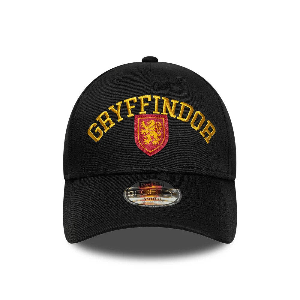 Youth Harry Potter Gryffindor Black New Era 9FORTY Adjustable Cap, front view showing the gold embroidered Gryffindor lettering and red crest with a lion on the structured black crown, with a 9FORTY size sticker on the curved black visor.