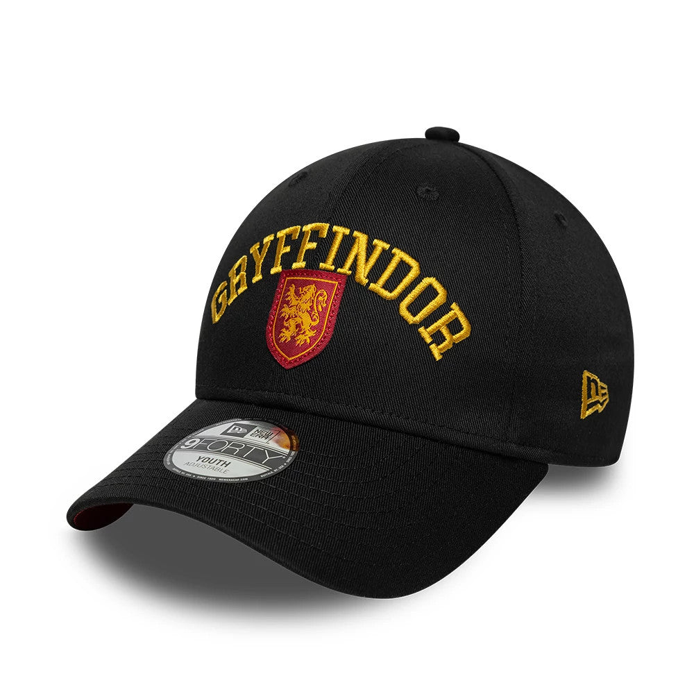 Youth Harry Potter Gryffindor Black New Era 9FORTY Adjustable Cap, front view showing raised yellow Gryffindor lettering and a red and yellow lion crest embroidery on the front panel, curved black visor with 9FORTY size sticker.