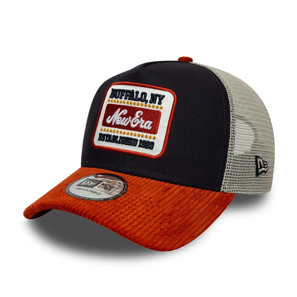 Pictured is this New Era Patch Cord 9FORTY A-Frame Trucker cap in navy & red. 1