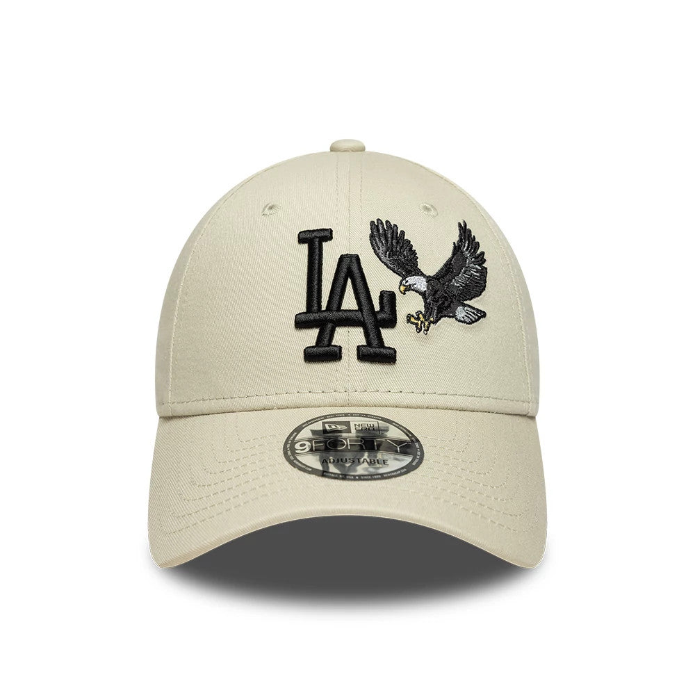 LA Dodgers MLB Outdoor Icon Cream New Era 9FORTY Adjustable Cap, front view showing the black embroidered LA logo next to a detailed eagle on the front panels, with a curved visor and a 9FORTY size sticker on it.