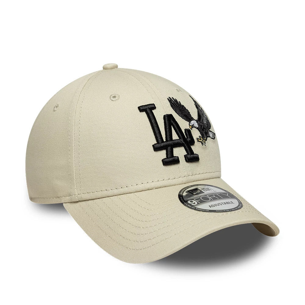 LA Dodgers MLB Outdoor Icon Cream New Era 9FORTY Adjustable Cap, three-quarter view showing raised black LA logo embroidery and an eagle graphic on the front panel, with a curved cream visor and 9FORTY size sticker on the top.