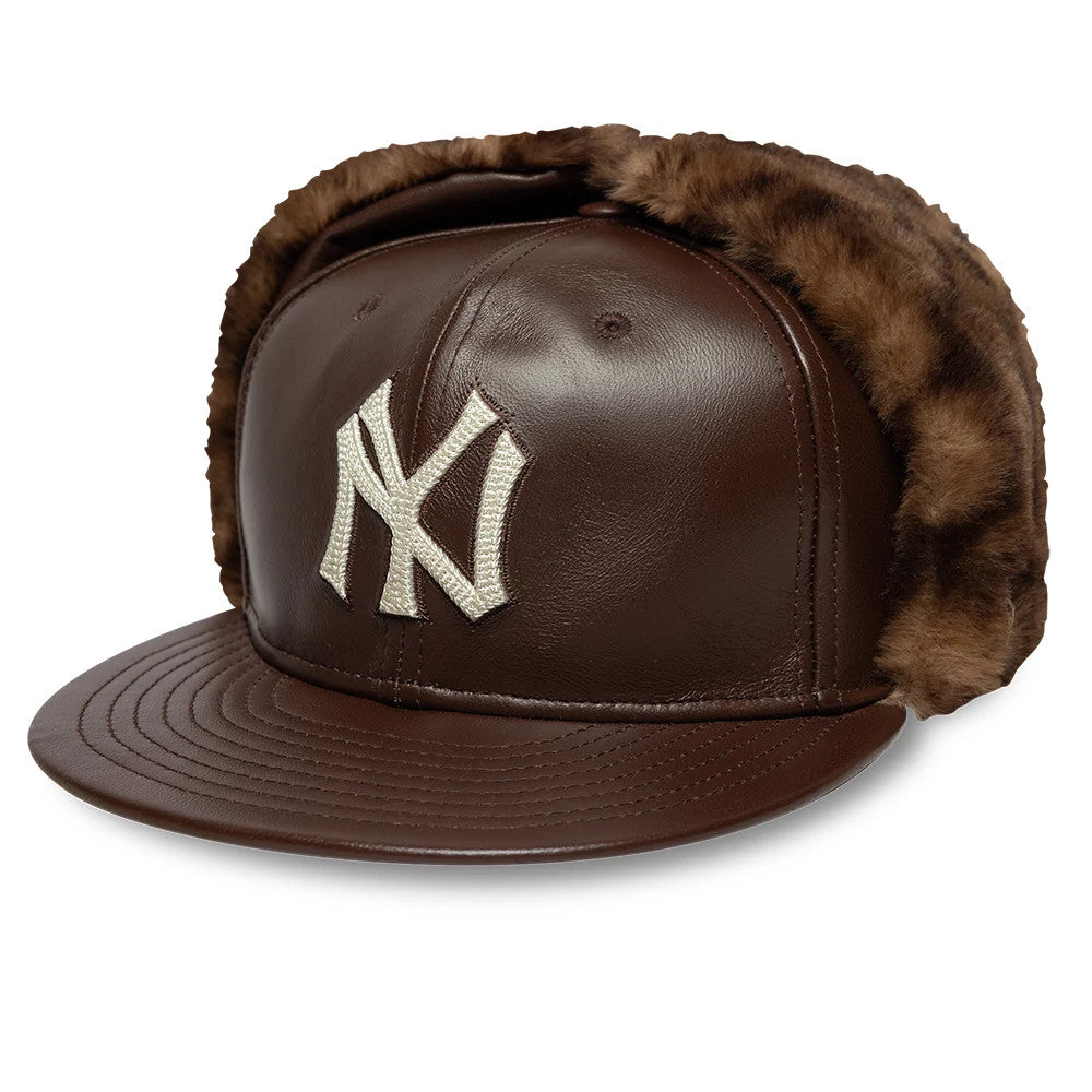 Pictured is this MLB Leather New York Yankees Dogear 59FIFTY Fitted cap in brown. 1