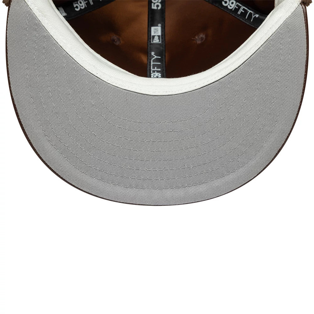 New York Yankees MLB Leather Brown Dogear New Era 59FIFTY Fitted Cap, inside view showing a grey undervisor, black 59FIFTY taping, and a brown satin sweatband, highlighting the leather-like interior finish.