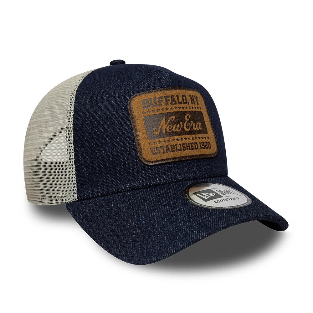 Pictured is this New Era Patch Denim 9FORTY A-Frame Trucker cap in dark blue. 3