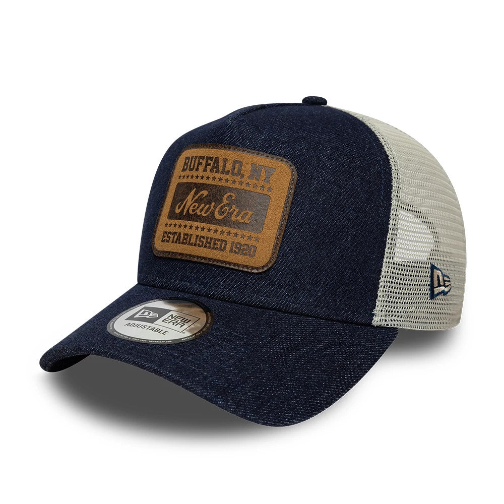 Pictured is this New Era Patch Denim 9FORTY A-Frame Trucker cap in dark blue. 1