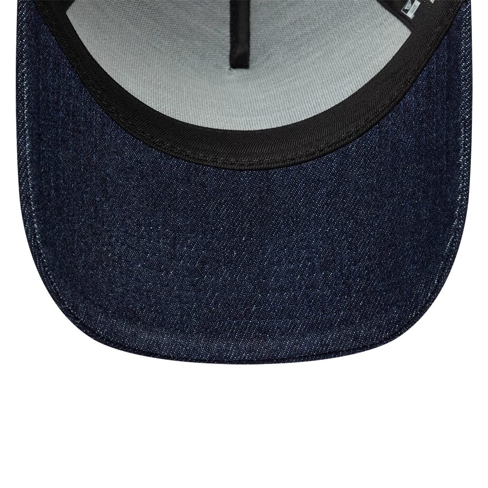 Pictured is this New Era Patch Denim 9FORTY A-Frame Trucker cap in dark blue. 5
