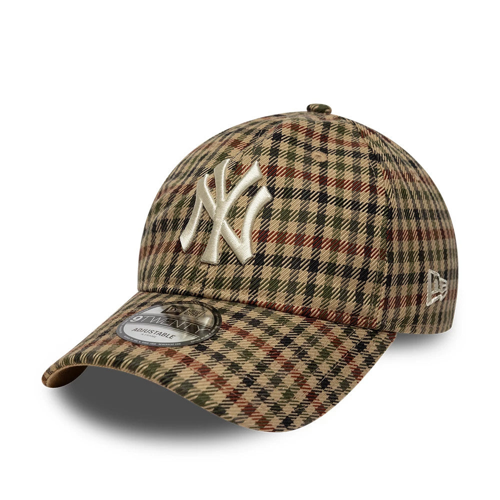 New York Yankees MLB Check Beige New Era 9TWENTY Adjustable Cap, three-quarter view showing the beige and brown check pattern, cream embroidered Yankees logo on the front panel, and white New Era flag logo on the left side, with 9TWENTY size sticker.