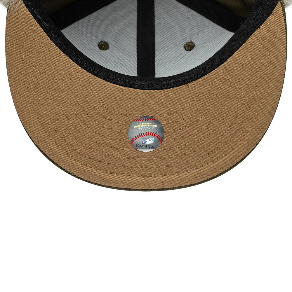 New York Yankees MLB Cotton Canvas Dark Green New Era Dogear 59FIFTY Fitted Cap, inside view showing the beige undervisor with immaculate stitching, MLB sticker at the centre, and black taping around the inner crown, enhancing its classic look.