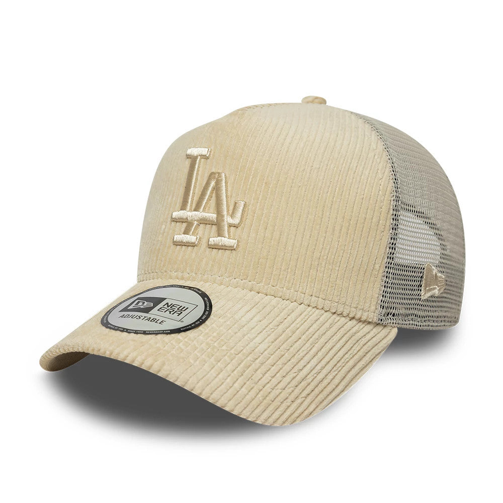 LA Dodgers MLB Cord Cream New Era 9FORTY A-Frame Trucker Adjustable Cap, three-quarter view showing the raised cream LA logo on the structured front panels, curved cream visor with 9FORTY size sticker, and New Era flag logo on mesh side.