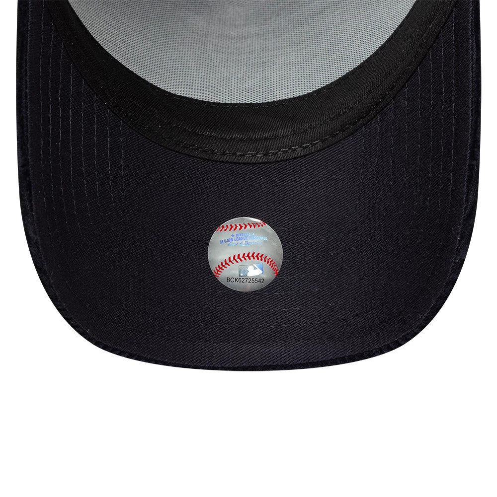 New York Yankees MLB Cord Navy New Era 9FORTY A-Frame Trucker Adjustable Cap, inside view showing a dark navy undervisor, grey mesh fabric lining the crown, and an MLB baseball hologram sticker centrally placed on the undervisor.