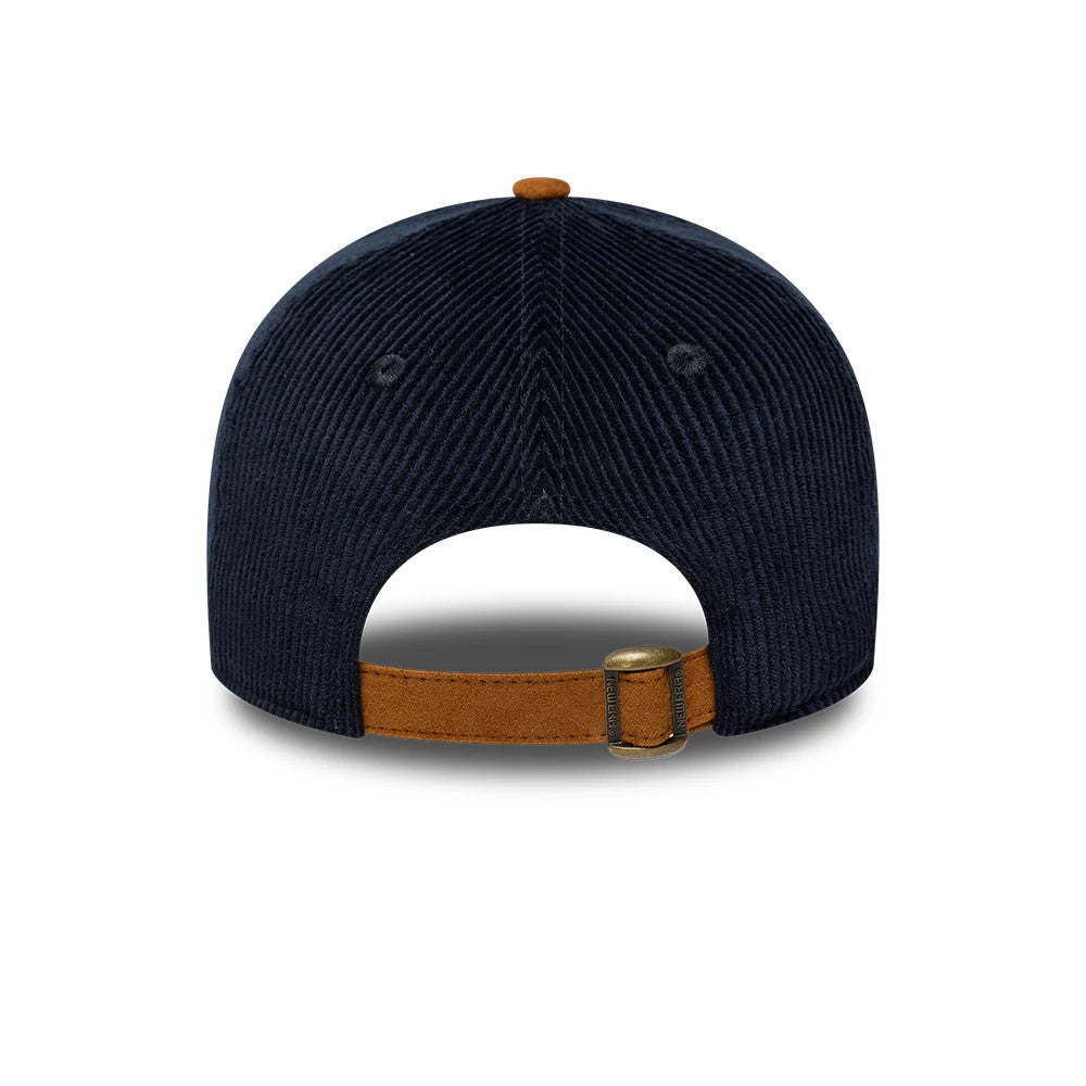New Era Cord Mix Navy & Brown 9TWENTY Adjustable Cap, rear view showing a dark navy corduroy crown with a brown top button, a brown adjustable strap with a buckle at the back, and evenly spaced eyelets.