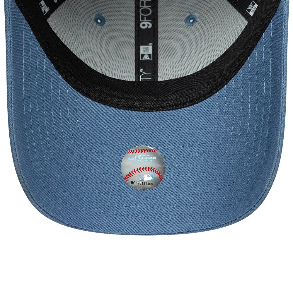 New York Yankees Womens MLB League Essential Blue New Era 9FORTY Adjustable Cap, inside view showing black taping with logos, a black sweatband, and a 9FORTY size sticker on the blue undervisor.